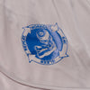 Close-up of the Y,IWO x Ace Hotel grey bodybuilding shorts featuring original blue Ariel Roman artwork of a flexed arm holding a dumbbell, surrounded by Work Out, Eat, Sleep, Repeat lettering.