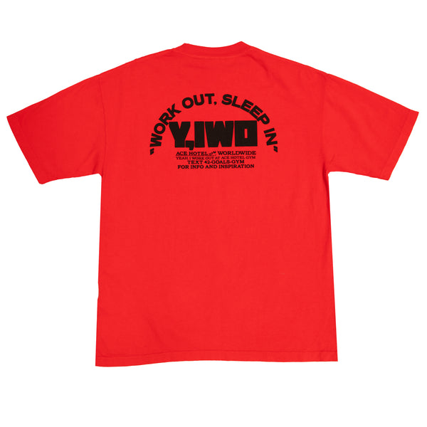 Back of the Y,IWO x Ace Hotel red heavyweight graphic T-shirt featuring oversized black Y,IWO lettering, Work Out, Sleep In slogan, and Ace Hotel Gym Worldwide branding.